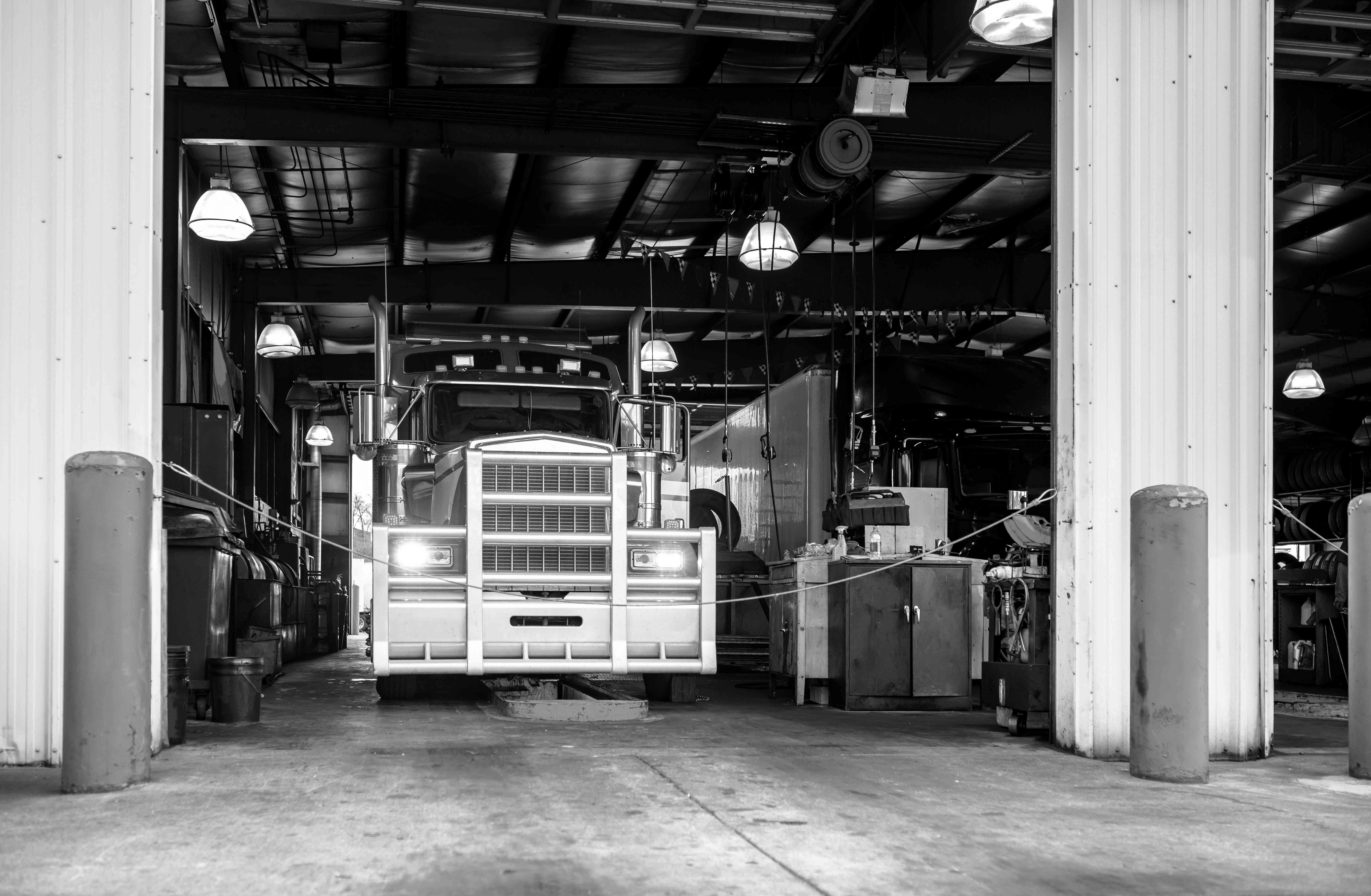 Heavy duty semi-truck in fleet service maintenance bay