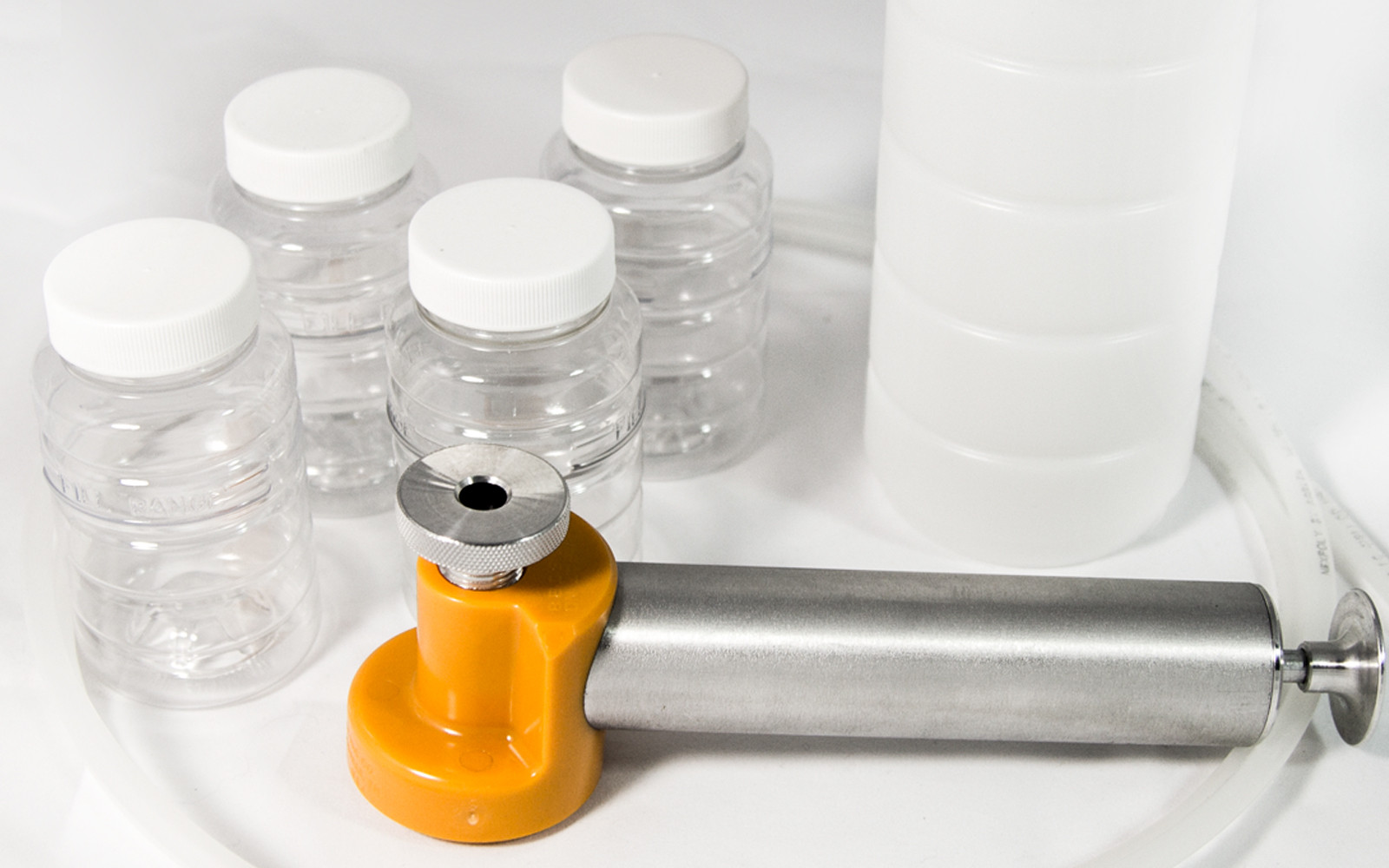 Oil sampling kit with vacuum pump, tubing, and sample bottles